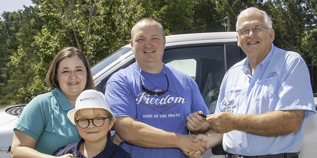 Winners of the annual meeting truck receive the keys from CEO Ronnie Lee