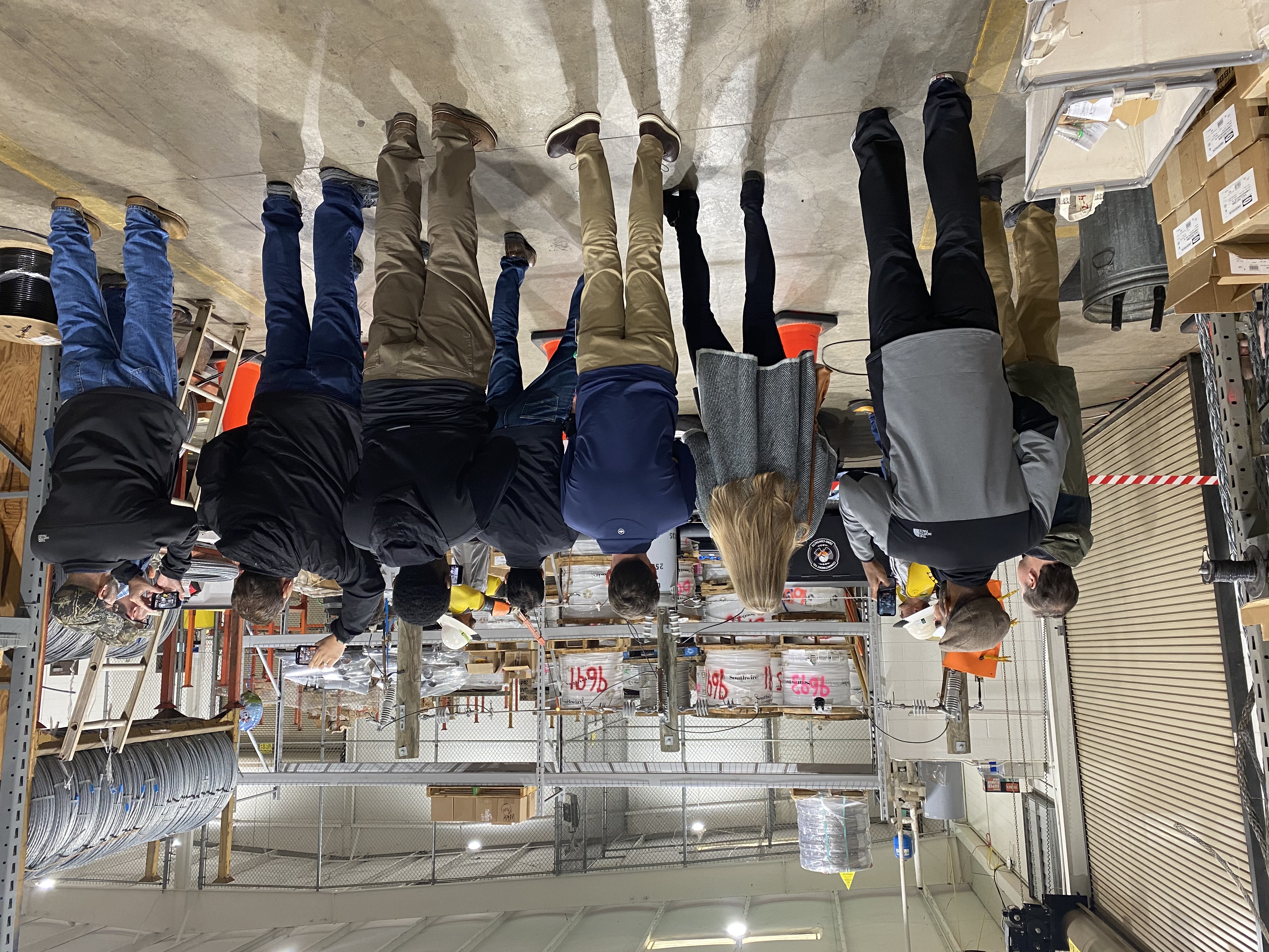 Workers watch a safety demonstration